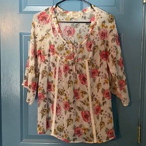 Sheer, floral top with 3/4 bell sleeves. Size medium.